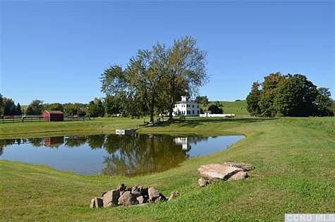 Centered on 35 acres, with protected viewshed across road, this country house epitomizes the best of Columbia County views.