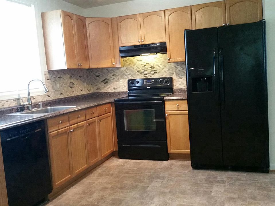 Remodeled kitchen with large Refrigerator.
