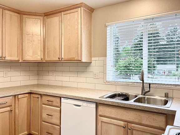 Oversized subway tile, wonderful storage and large kitchen is a dream come true! Kitchens with cherry cabinets may feature different tile and floor selections. Check out what's available!