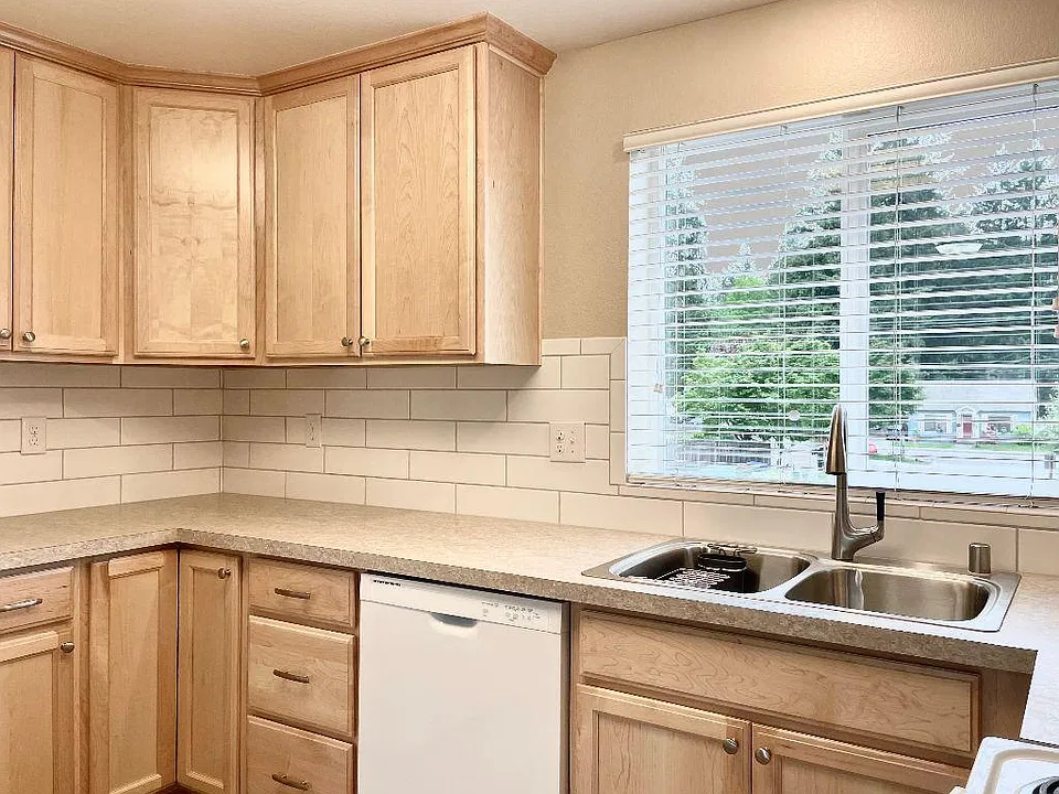 Oversized subway tile, wonderful storage and large kitchen is a dream come true! Kitchens with cherry cabinets may feature different tile and floor selections. Check out what's available!