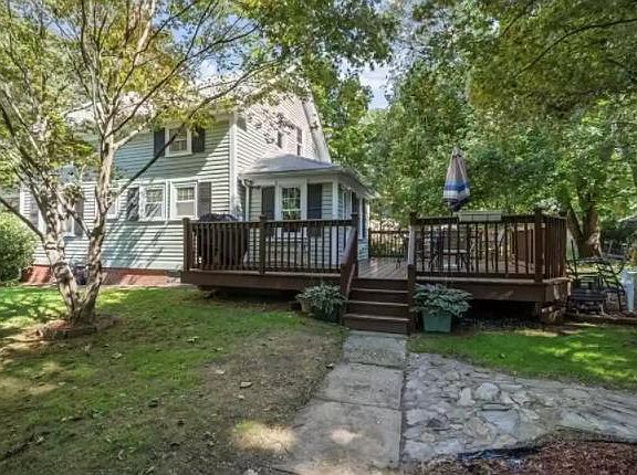 Right side of house, off driveway, and large woodend back deck, just stained/painted.