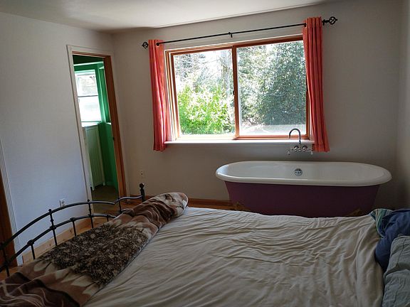 Mstr bdrm with tub and beautiful forest view