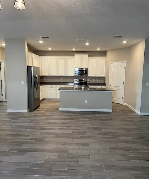 KITCHEN OPEN TO LIVING ROOM
