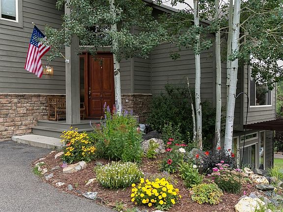 Beautiful professionally landscaped entry gardens