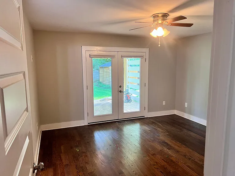 Master bedroom with French doors out on to back porch