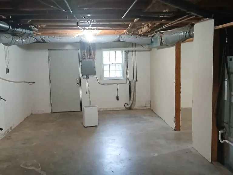 Unfinished basement with wash/dryer hookup