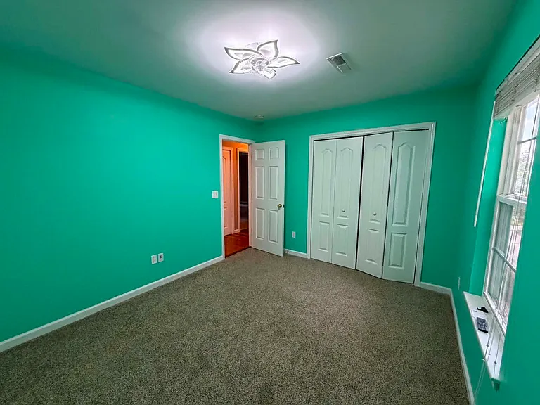 Bedroom 1, great as a child's room or in-home office space, remote controlled ceiling fan