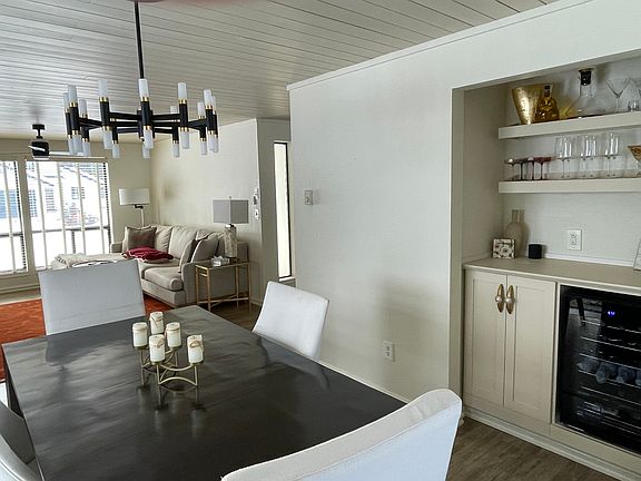 Dining Room with wine fridge and bar area