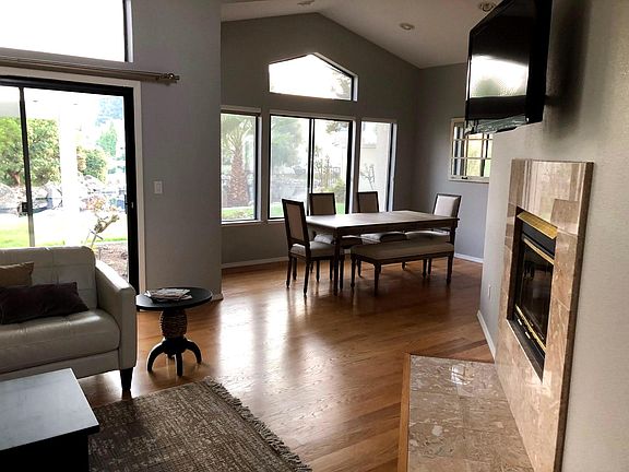 Living room looking into dining room with view of the lagoon