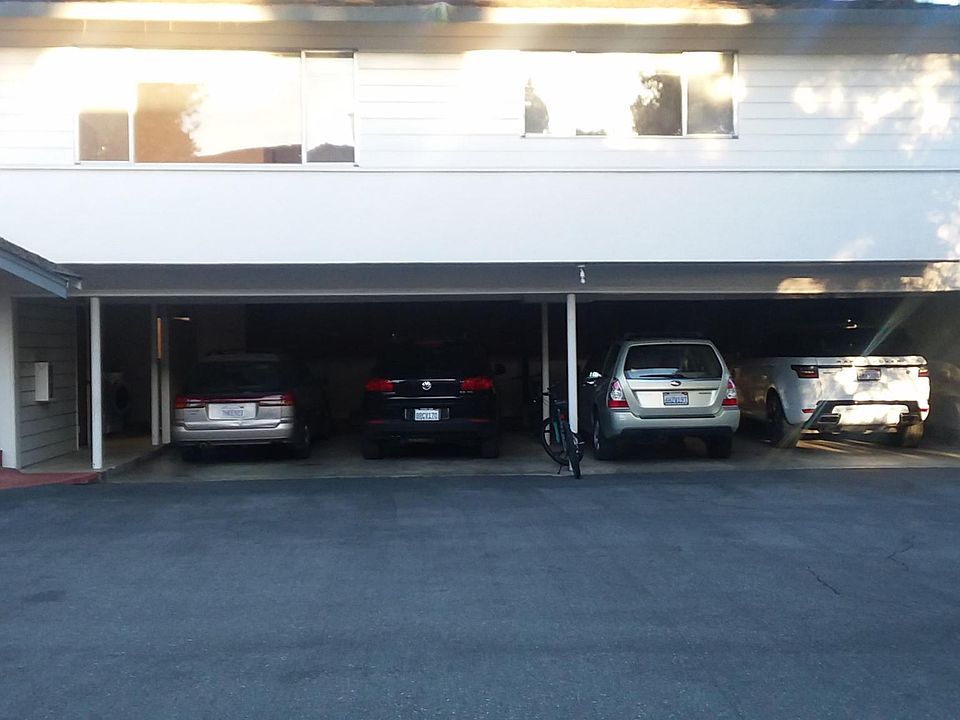 The apartment for rent sits atop this entire garage. NO common walls and no one beneath you.. Laundry is right at the bottom of the tile stairs.