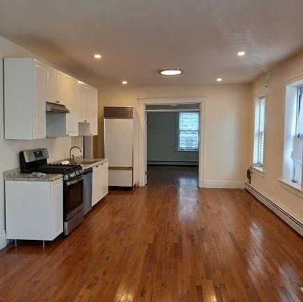 The open plan consists of a light-filled combination living and dining room with an all new kitchen with new appliances including a dishwasher.
