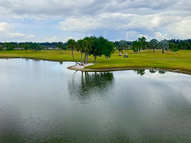 Absolutely gorgeous expansive lake & golf course views to enjoy from the comfort of your living room!