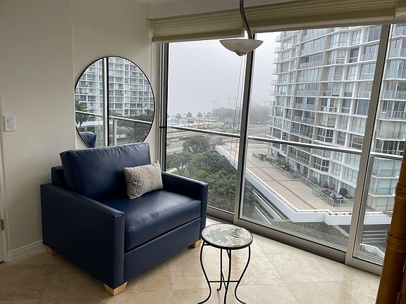 Sitting area with views of Bay & Ocean - chair pulls out into twin size bed.