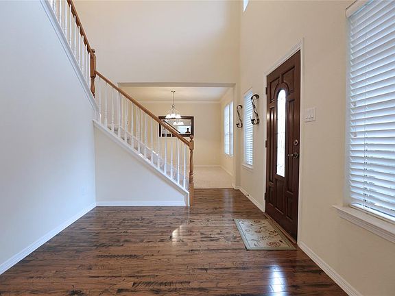The main entry, with a view to the dining room. The foyer has 2 story ceilings with lots of windows for extra light.