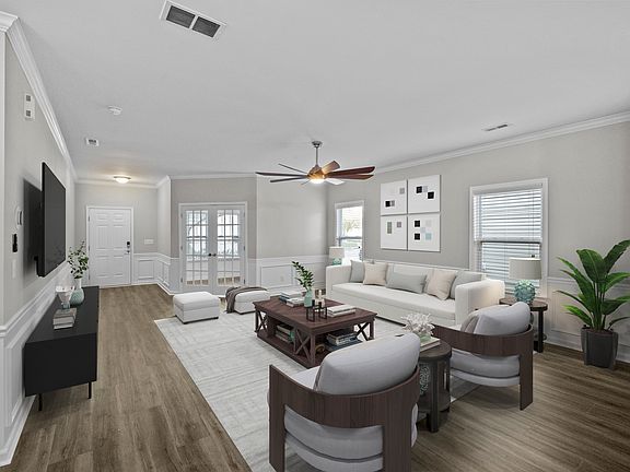 VIRTUALLY STAGED PHOTO - Inside, this upgraded home features an open-concept layout with fresh paint and new luxury flooring throughout