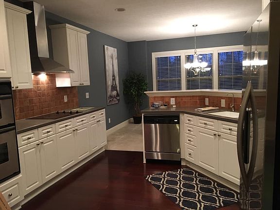 Open, spacious kitchen with abundance of cabinet space and built-in stainless-steel appliances.