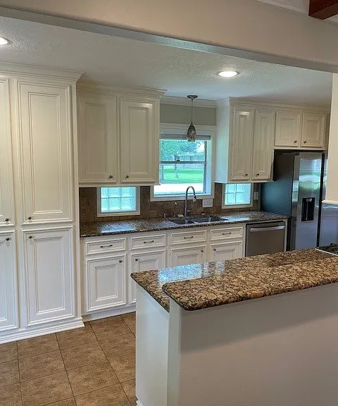 Kitchen with custom cabinetry and granite countertops.