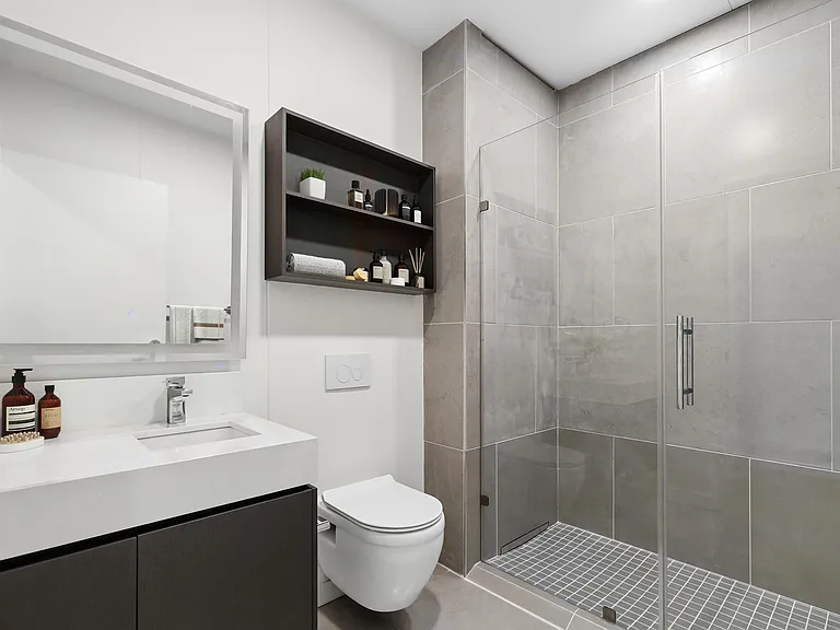 Refresh and recharge in a bathroom featuring contemporary finishes and elegant details.