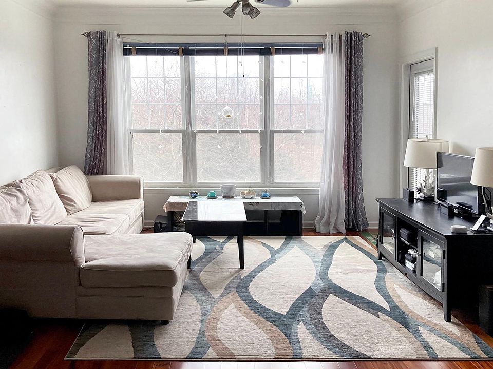Spacious living room with large window.