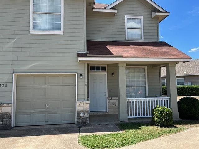 Entrance to duplex showing extra parking.