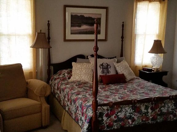 Master bedroom has cherrywood furnishings.