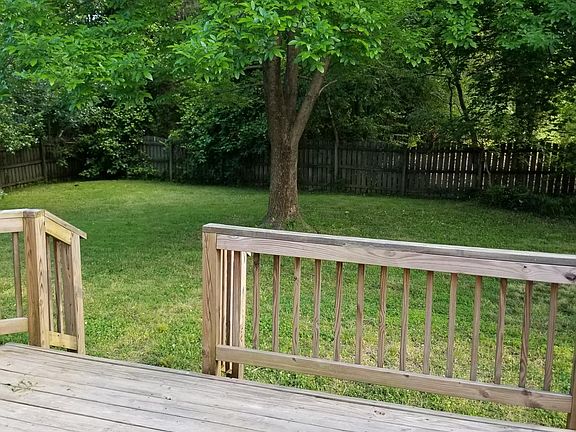 Deck and large fenced backyard