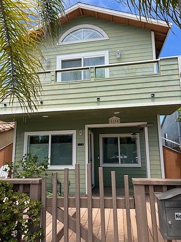Two story beach house, large decked front patio, second floor balcony off main bedroom