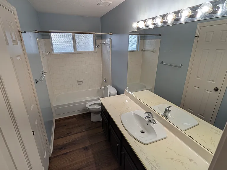 The second bathroom has a large linen closet, spacious vanity and plenty of light to see yourself start the day!