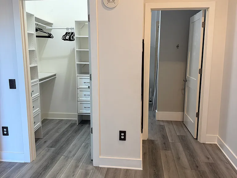 bedroom access to closet and bathroom.