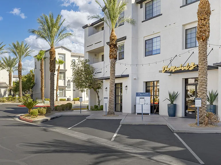 Tall, graceful palm trees line the pathway, adding a touch of tropical elegance to the space.