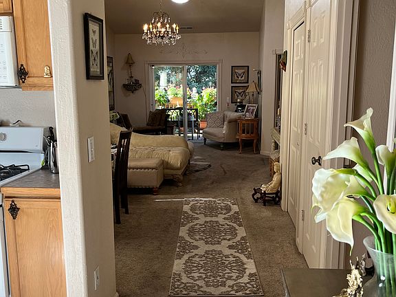 Entryway with small bedroom off to the immediate right and kitchen to the left