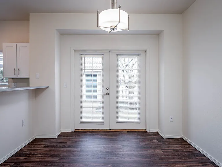 Village at Main Street | 2x2 Dining Room with Plank Like Flooring and Pendant Lighting