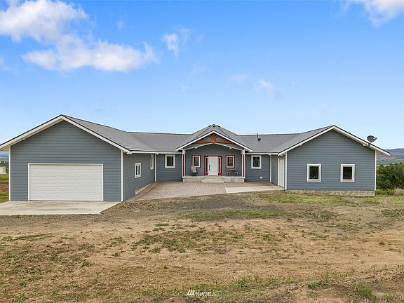 Built in 2018, this home is like new with amazing territorial views, fine accents, master build and extras such as a wine room.