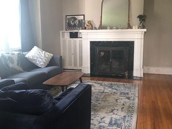 living room with wood-burning fireplace