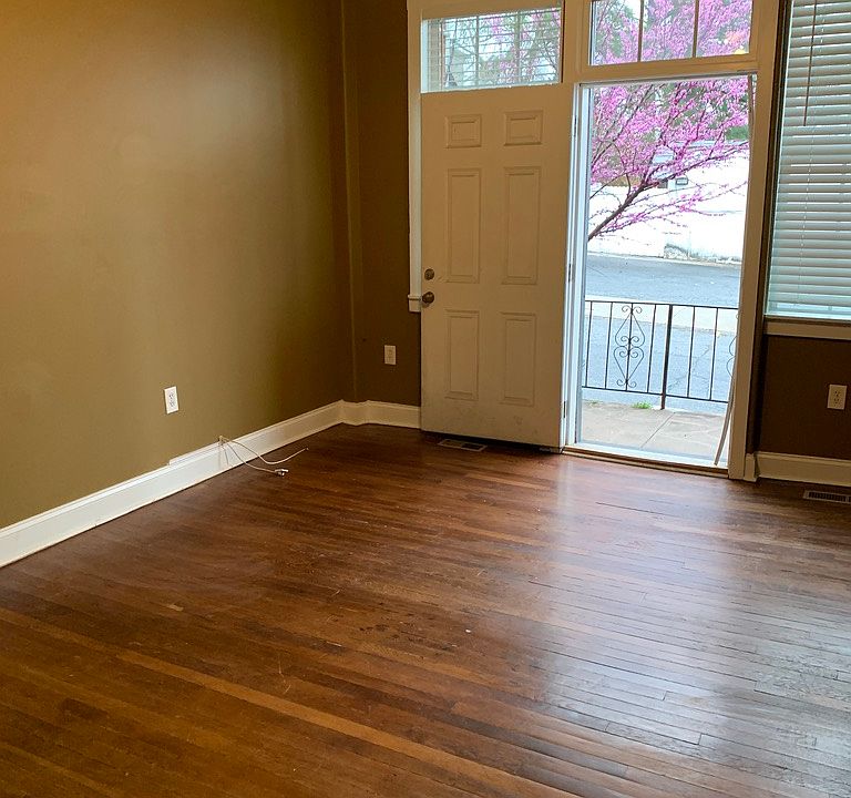Living room with view of balcony facing Kennesaw Ave