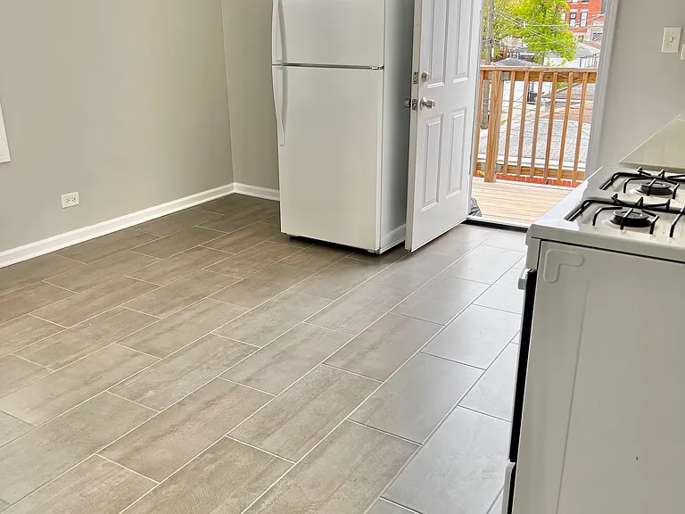 Eat-in kitchen. Back door to wood porch.