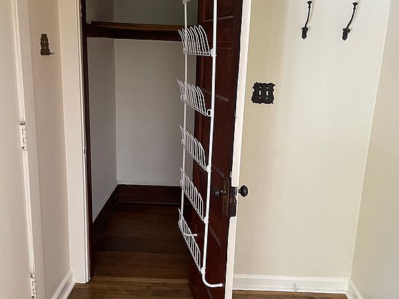 Entry with closet and shoe rack.