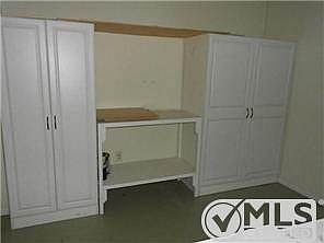 Great storage in spacious Laundry/Utility Room