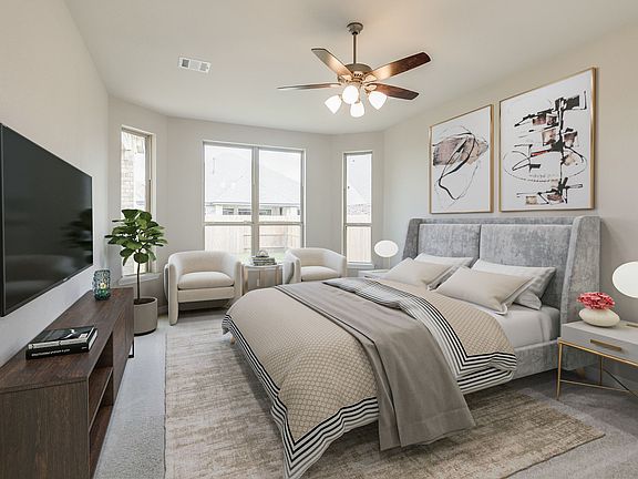 Primary bedroom featuring bay windows