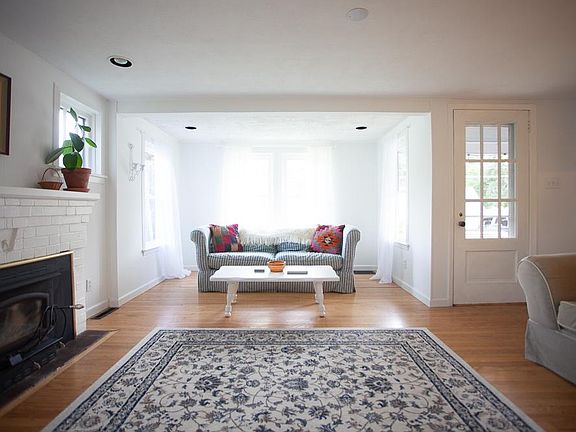 Comfortable living room with lots of natural light. Great for house plants!!