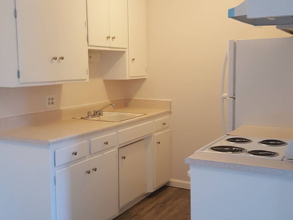 Bright kitchen with new appliances and all new flooring.