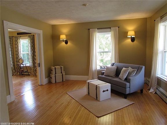 Large living room with plenty of natural light flowing in.