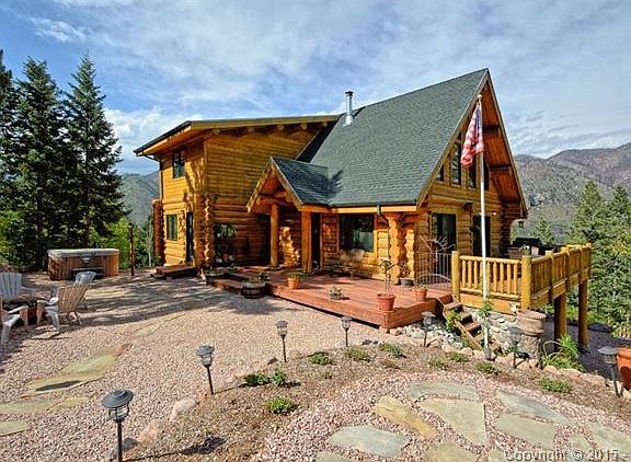 Custom A-frame log home with 360 degree views of mountains and r