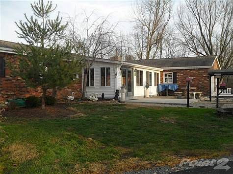 REAR VIEW OF MAIN HOUSE.  SUNROOM IN THE REAR, ALSO PATIO FOR ENTERTAINING.  EASY ACCESS TO THE BARN, FARM. ETC.  2 CAR GARAGE IS ATTACHED!  LUSH LANDSCAPING TO ENJOY!