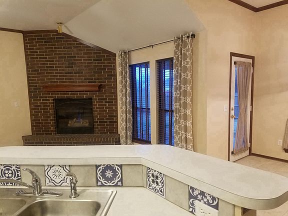 Living room fireplace from kitchen