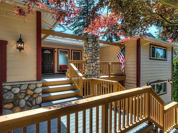Newer composite decking leads you to the large front porch and entry. 