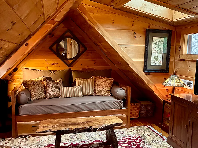 Loft Area with Half Bath. Twin daybed. Fold out twin bed with 4 inch memory foam mattress. Built in desk. TV.