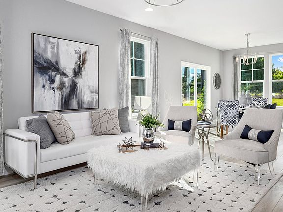 Family room with large windows, breakfast area with sliding glass door and large double window