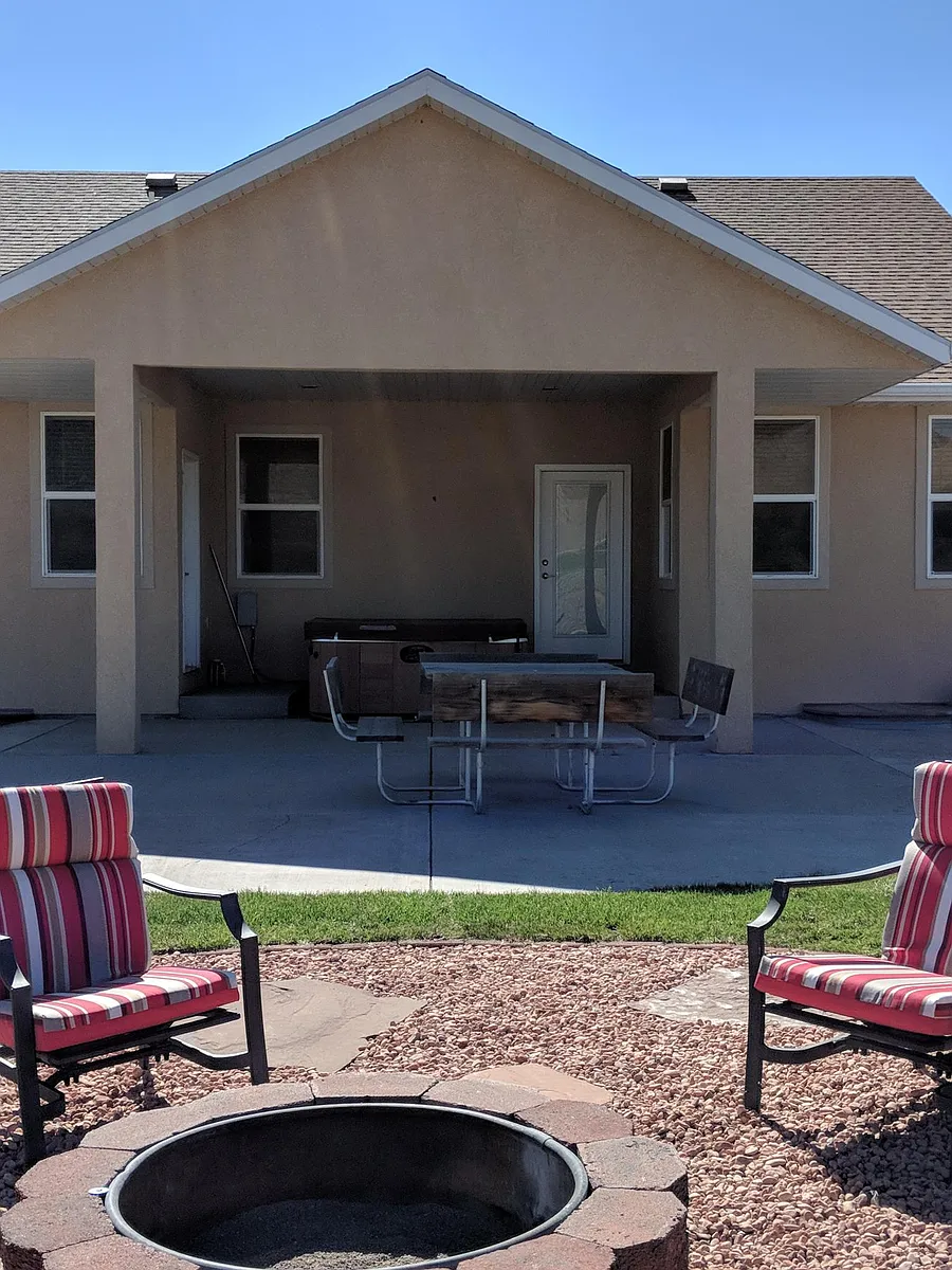 Back of home with patio and fire pit area. - 581 N State Route 62