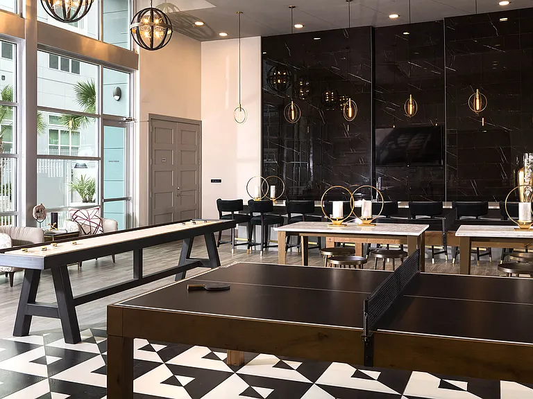 Step into the pool lounge, where shuffleboard and ping pong tables offer endless fun while you unwind by the water.